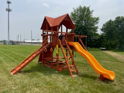 Woodplay swing set with slide, ladder, swings, and more